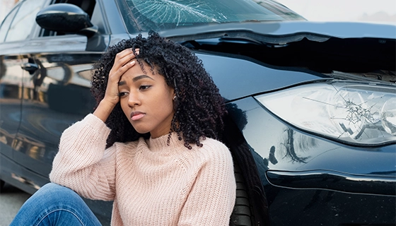 Woman In Car Accident Looking Distraught
